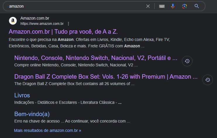 Captura de tela dos resultados de uma busca na web pelo termo "amazon". O primeiro resultado é do site Amazon.com.br Logo após, há links para páginas já visitadas, como "Nintendo, Console, Nintendo Switch, Nacional, V2, Portátil" e "Dragon Ball Z Complete Box Set: Vols. 1-26 with Premium". Depois, aparecem os demais sitelinks: um link de livros e outro para acessar o serviço. 