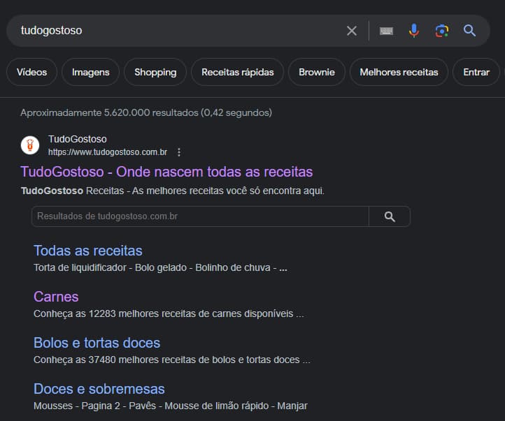 Captura de tela de um navegador da web para a consulta 'tudogostoso'. O resultado mostra o site tudogostoso.com.br, com sitelinks para páginas de todas as receitas, carnes, bolos e tortas e sobremesas. Exibe também uma barra de pesquisa para pesquisar outras receitas no site. 